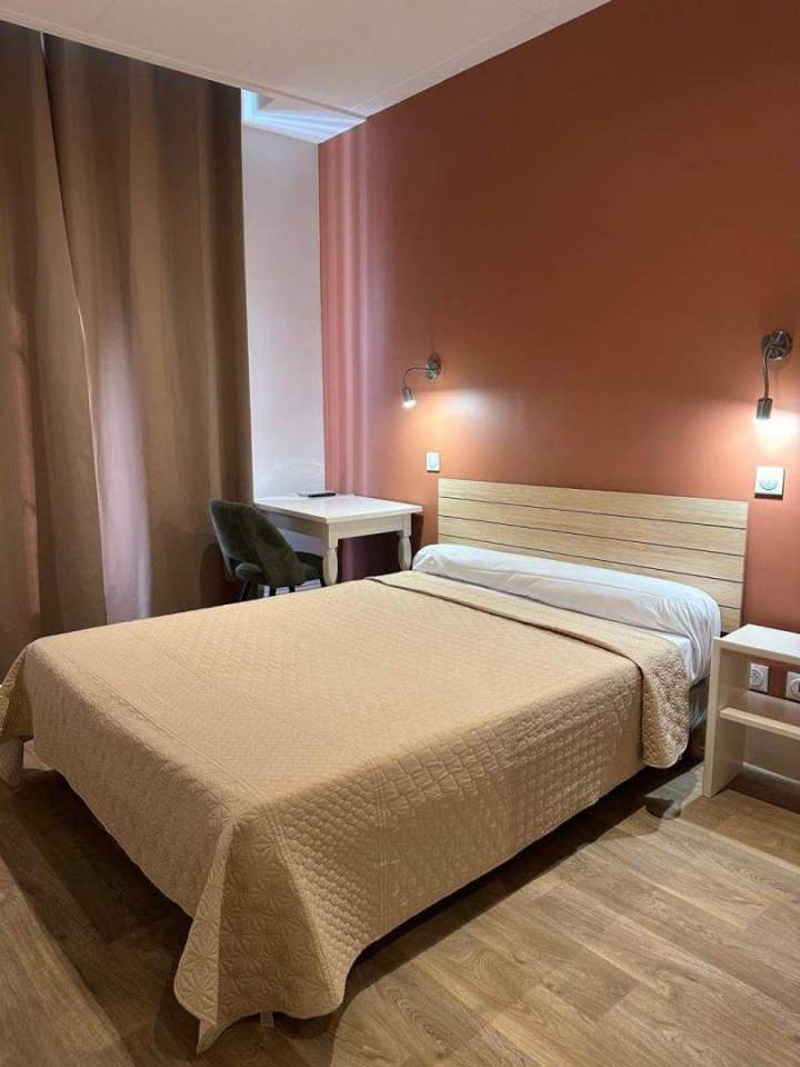 Room with a comfortable bed Lyon